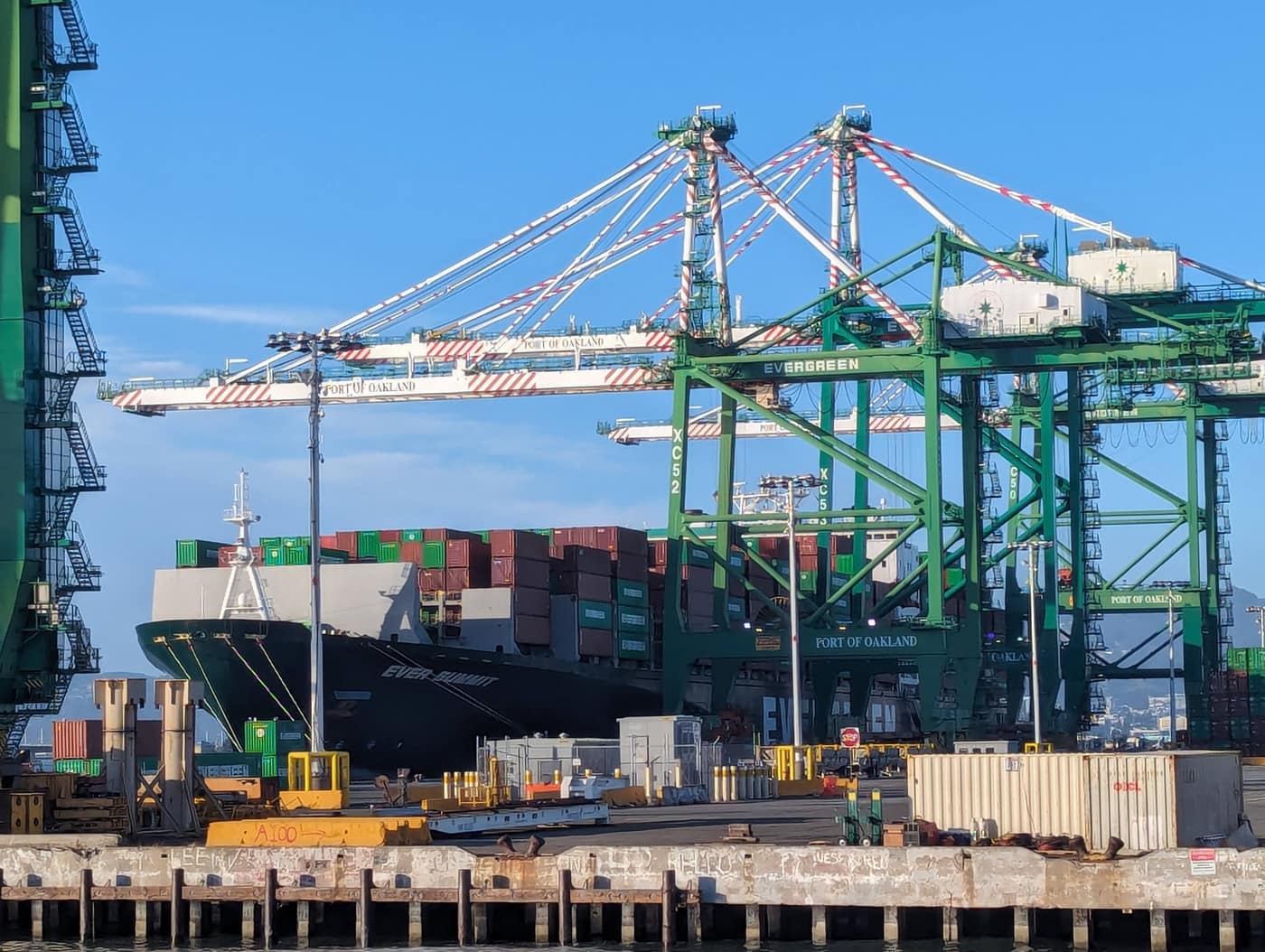Ship-to-shore cranes loading containers onto a vessel at a marine terminal