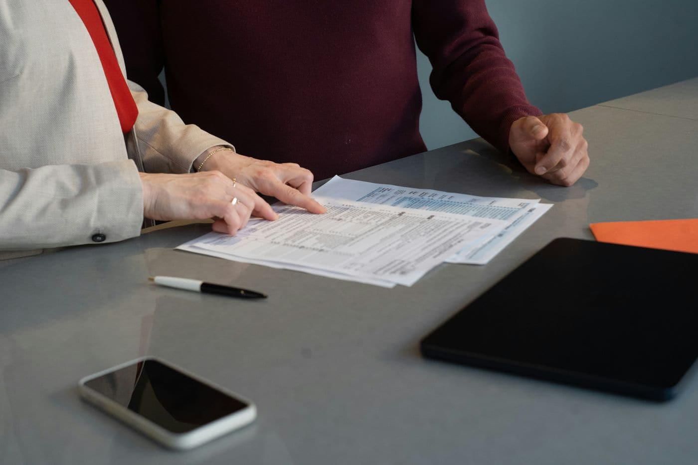Reviewing trade documents at a desk
